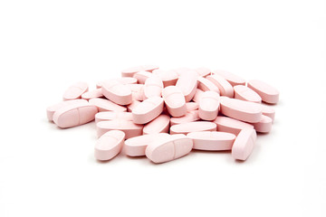 Obraz na płótnie Canvas Pink pills on white background