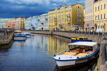 Fototapeta na wymiar River channel with boats in Saint Petersburg. Summer