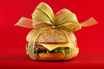 Gift wrapped hamburger , conceptual food image - 74084331