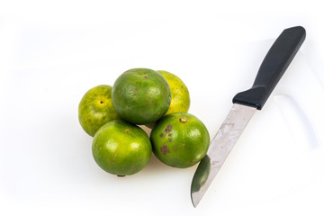 Limes on the white background