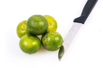 Limes on the white background
