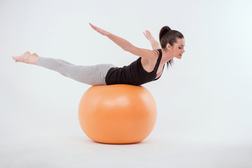 Healthy young sportswoman does the exercises © zinkevych
