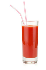 Tomato juice in glass with two drinking straws
