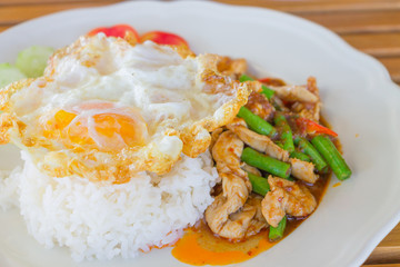 Chicken and cowpea fried with chillies ,fried egg