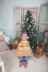 Little girl and Christmas tree