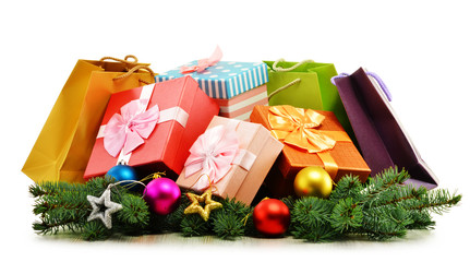 Colorful gift boxes and paper bags isolated on white