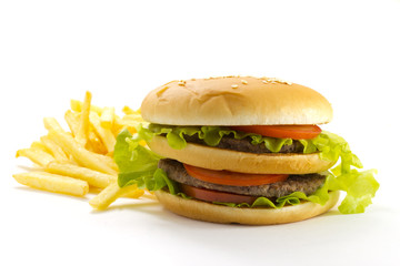 Big and tasty hamburger and fried potatoes isolated 