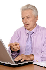 Mature man sitting at the laptop