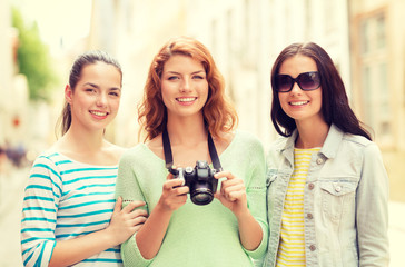 smiling teenage girls with camera