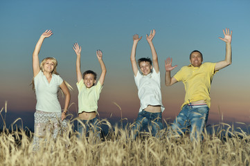 Smiling family jumping
