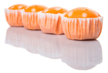 Orange colored steamed rice polka dot muffin or apam polka dot 