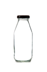 Empty glass bottle of milk with cap