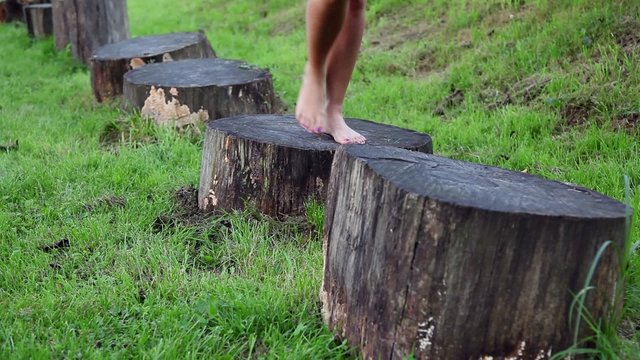 Woman walking barefoot on the trunk