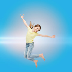smiling little girl jumping