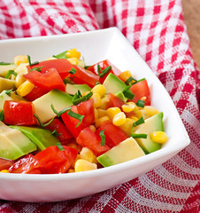 Mixed salad with avocado, tomatoes and sweet corn