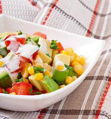 Mixed salad with avocado, tomatoes and sweet corn