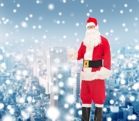 man in costume of santa claus showing thumbs up