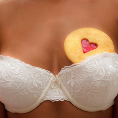 Heart-shaped cookie sticked into the bra