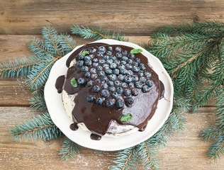 Christmas chocolate cake with chocolate ganache, cream-cheese fi