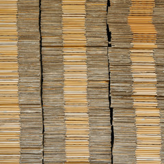 Many unpack paper box stacking on black pallet in front of wareh