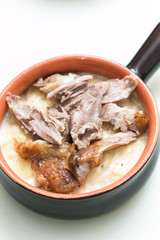 Baked potatoes with cheese and roasted duck legs
