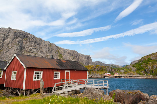 Typical red rorbu fishing hut in village Nusfjord