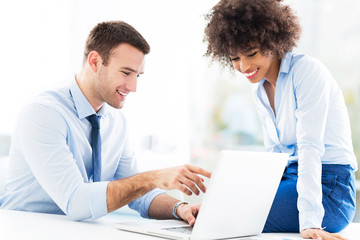Fototapeta premium Business people looking at laptop