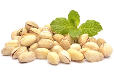 Heap of pistachios on white background