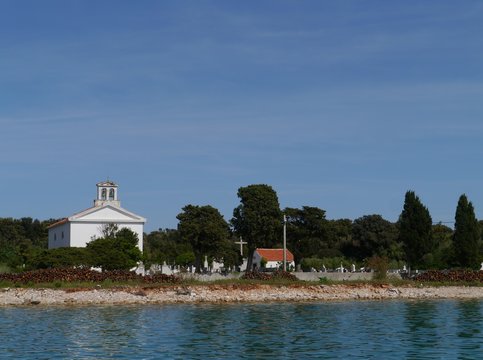 A white church on the graveyard of Olib in Croatia
