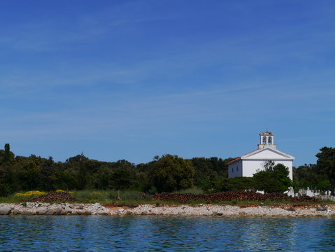 A white church on the graveyard of Olib in Croatia