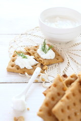 Flat gluten free bread with cream cheese and dill topping