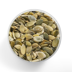 pumpkin seeds in a glass jar shot from above