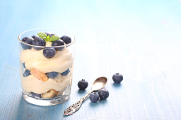 Fresh blueberry layered desert with mascarpone cream and cookies