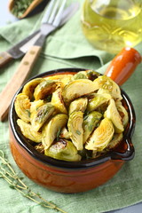 Vegetarian bowl of roasted brussel sprouts with garlic and thyme