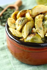 Vegetarian bowl of roasted brussel sprouts with garlic and thyme