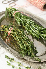 Fresh aromatic herbs rosemary and thyme on metal plate