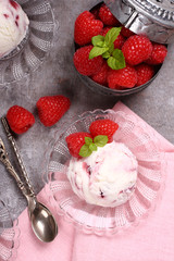 Homemade berry ice cream decorated with fresh raspberries