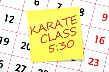 Photo sur Aluminium Arts martiaux Karate Class reminder note on a wall calendar