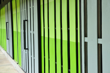 Warehouse gate closed, green and gray color