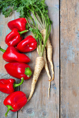 red pepper and parsley root on a wooden background.selective foc