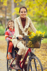 Young mother riding a bilcycle