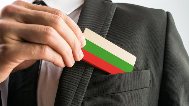 Man withdrawing a wooden card painted as the Bulgarian flag