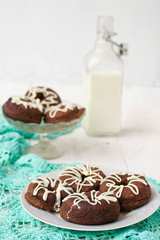 Chocolate donuts with white icing