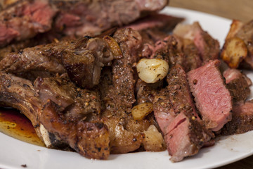 Plate of Grilled Steak and Garlic with Red Napkin