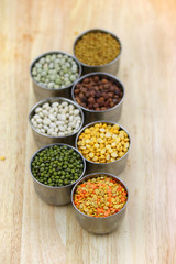 Different lentils in the small tumblers