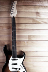 Fototapeta premium Guitar on wooden background