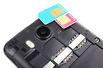 Obraz premium cell phone and sim card, isolated on white