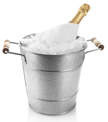 Bottle of champagne in metal ice bucket isolated on white