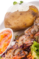 Grilled prawns with endive salad and jacket potato