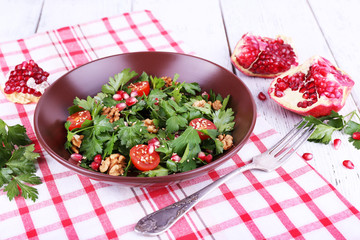 Fresh salad with greens, garnet and spices